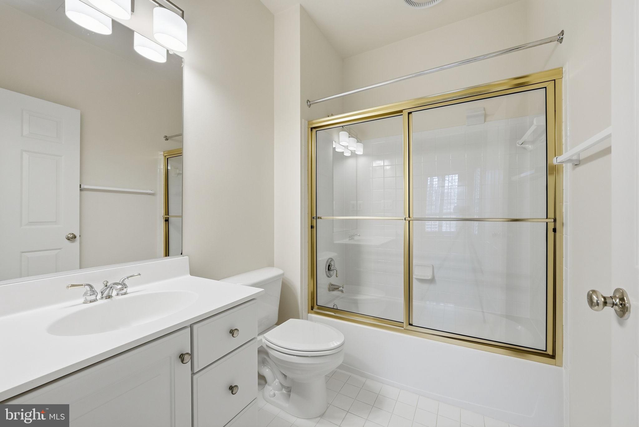 11588 Cedar Chase Road Herndon, VA 20170 - Photo 69 of 81 a bathroom with a shower sink vanity mirror and toilet