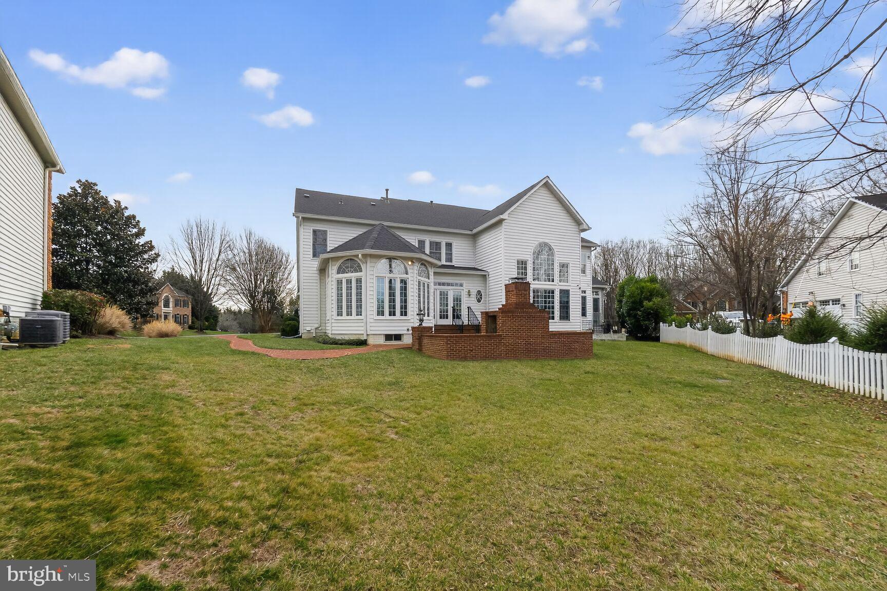 11588 Cedar Chase Road Herndon, VA 20170 - Photo 80 of 81 a front view of a house with a garden and trees