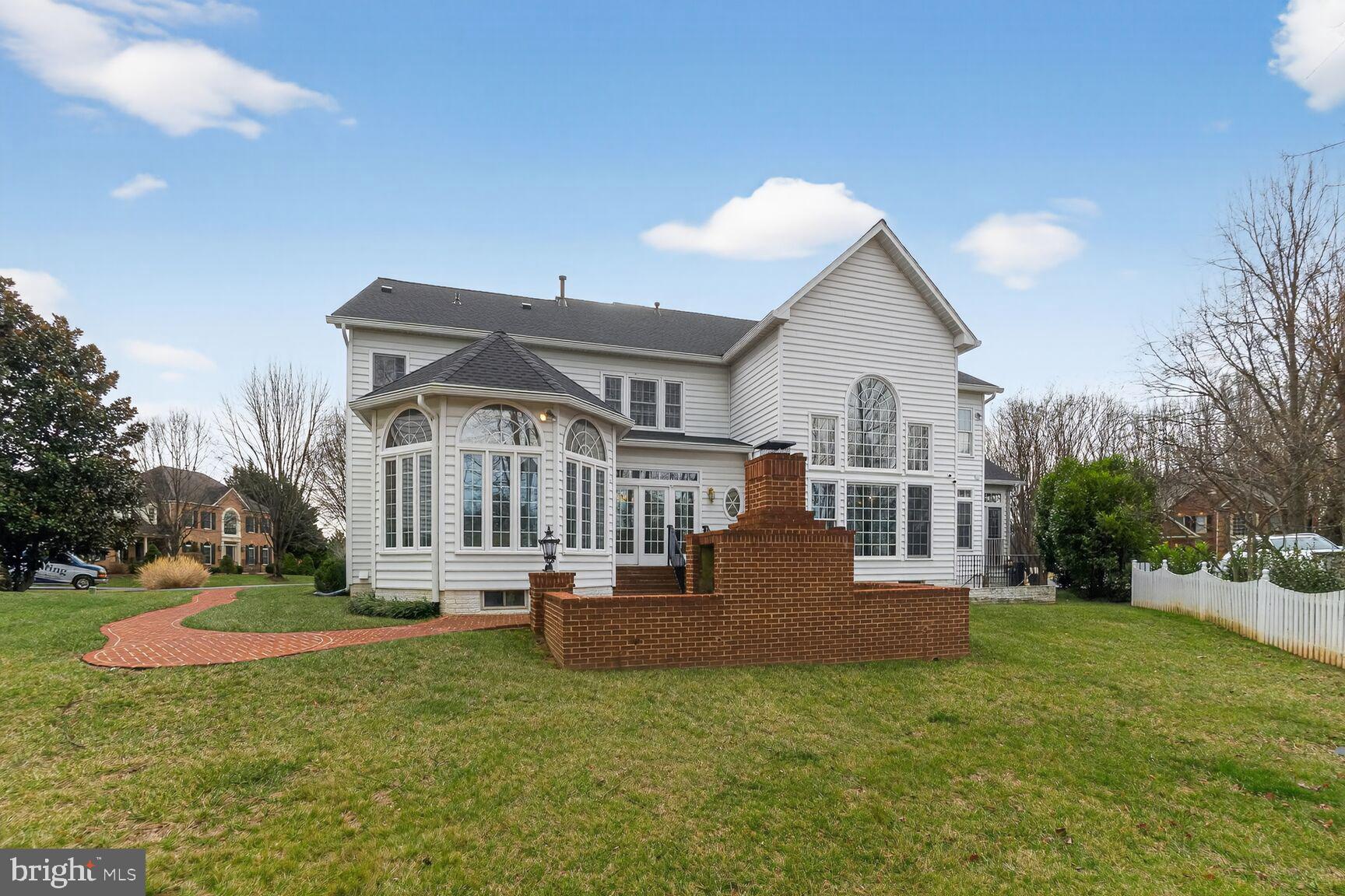 11588 Cedar Chase Road Herndon, VA 20170 - Photo 81 of 81 a front view of a house with a yard table and chairs