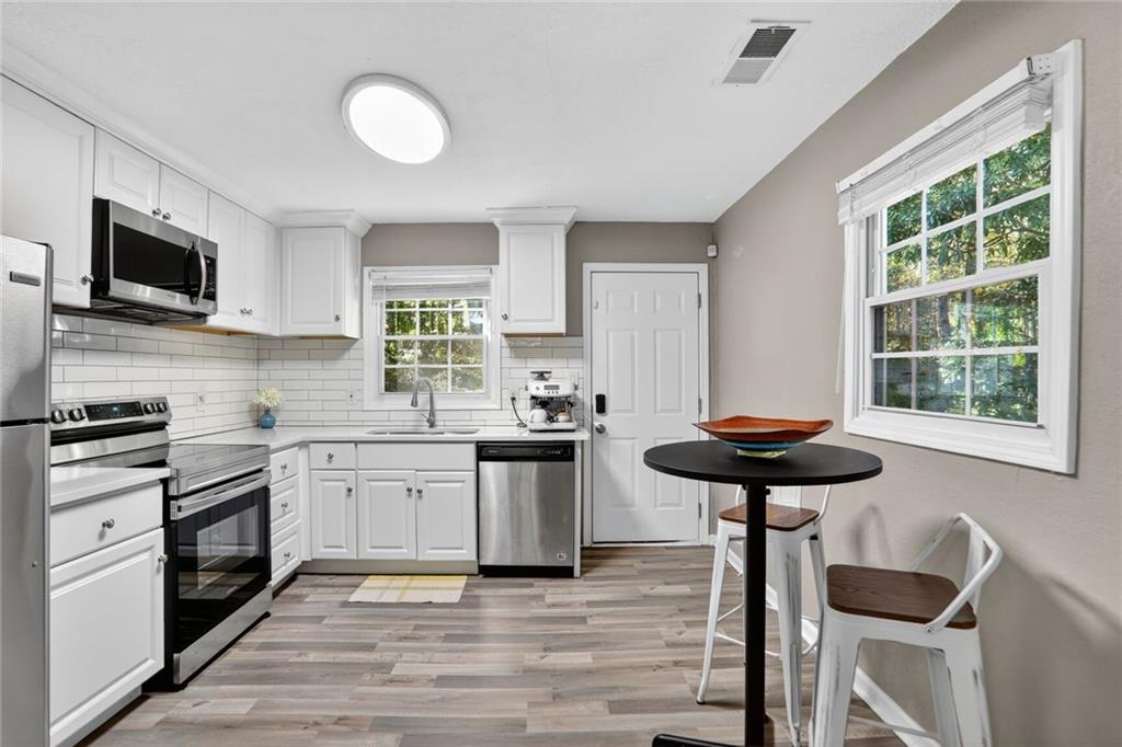 2019 Grant Road Southwest Atlanta, GA 30331 - Photo 1 of 17 a kitchen with a stove and a sink