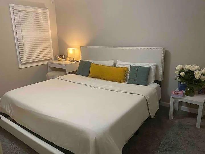 2019 Grant Road Southwest Atlanta, GA 30331 - Photo 11 of 17 a large bed sitting in a bedroom next to a window