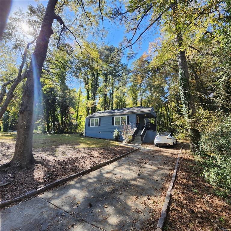2019 Grant Road Southwest Atlanta, GA 30331 - Photo 14 of 17 a view of a outdoor space with a tree