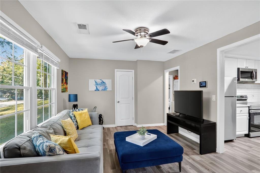 2019 Grant Road Southwest Atlanta, GA 30331 - Photo 3 of 17 a living room with furniture and a flat screen tv