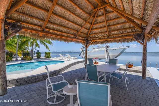 a view of yard with patio