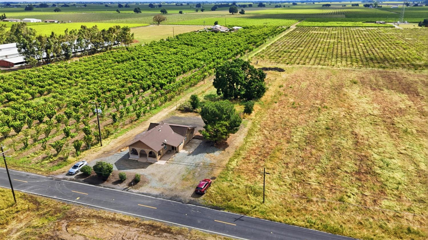 20042 North Ray Road Lodi, CA 95242 - Photo 37 of 63 a view of a swimming pool with a yard