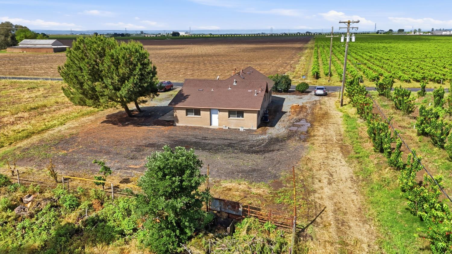 20042 North Ray Road Lodi, CA 95242 - Photo 38 of 63 a aerial view of a house with a lake view