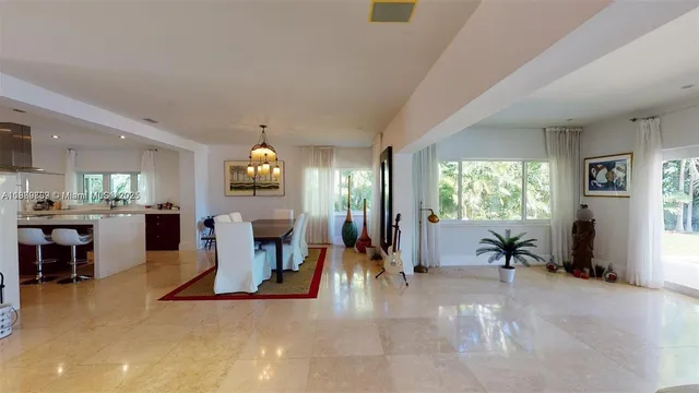 a living room with fireplace furniture and a flat screen tv