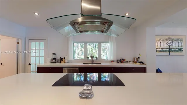 a front view of a house with a yard table and chairs