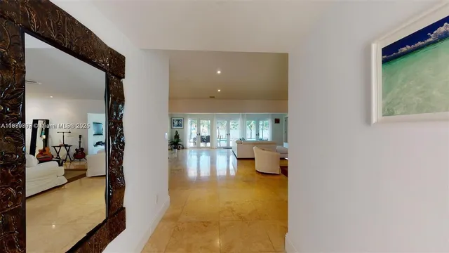 a bedroom with a bed and a mirror