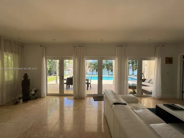 a view of a lake with palm trees