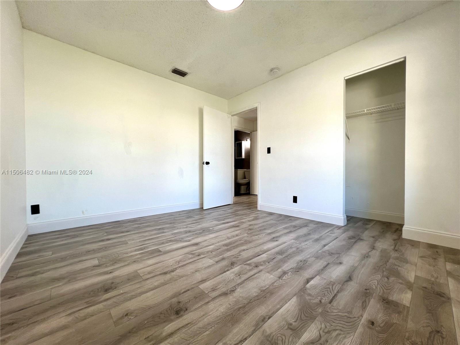 6034 Triphammer Road Lake Worth, FL 33463 - Photo 4 of 10 a view of an empty room