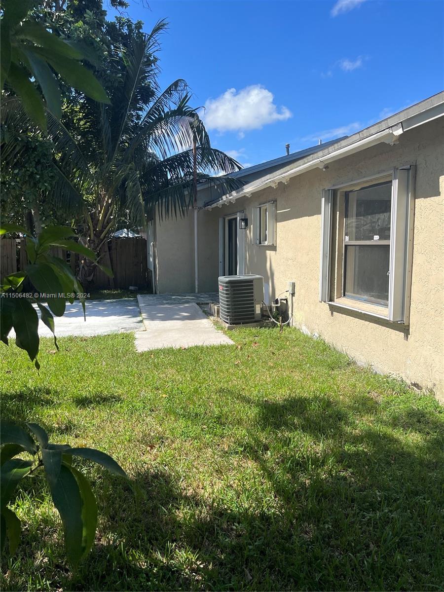 6034 Triphammer Road Lake Worth, FL 33463 - Photo 10 of 10 a view of a house with a backyard