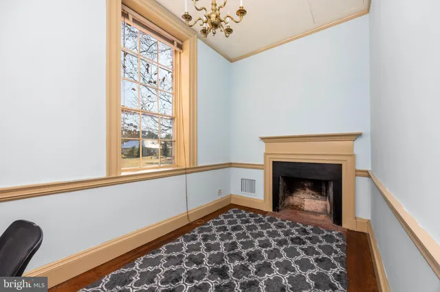 a kitchen with stainless steel appliances granite countertop a stove a sink and a granite counter tops with wooden floors