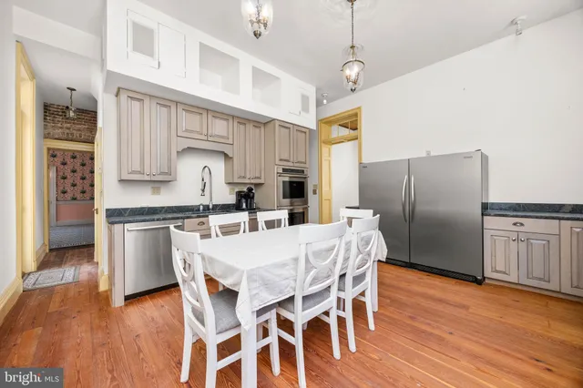 a spacious bedroom with a bed and a fireplace