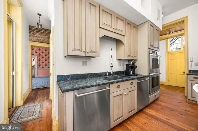 a view of a porch with wooden floor and furniture