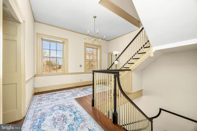 a view of a house with a snow in the yard