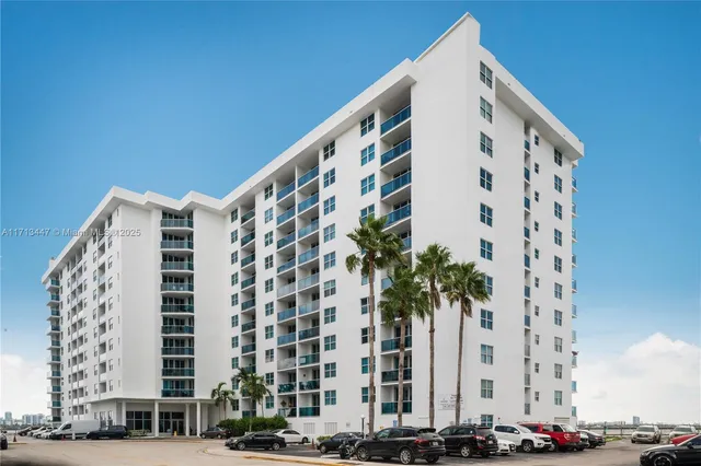 a view of cars parked in front of a building