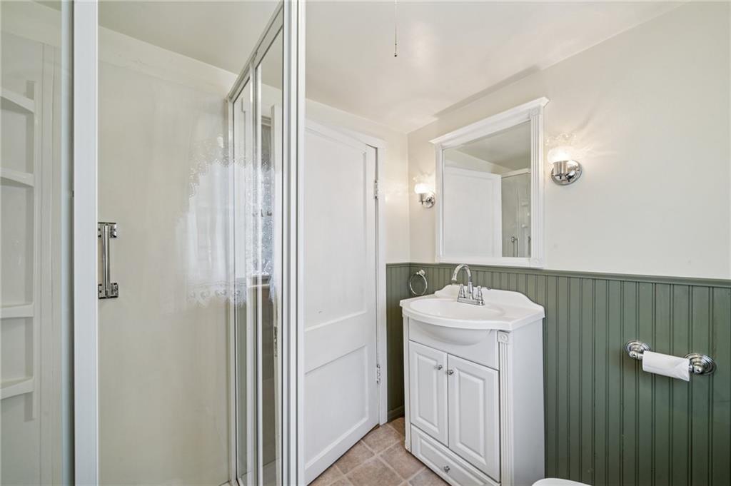 161 Millertown Road Normalville, PA 15469 - Photo 15 of 30 a bathroom with a sink a toilet and mirror