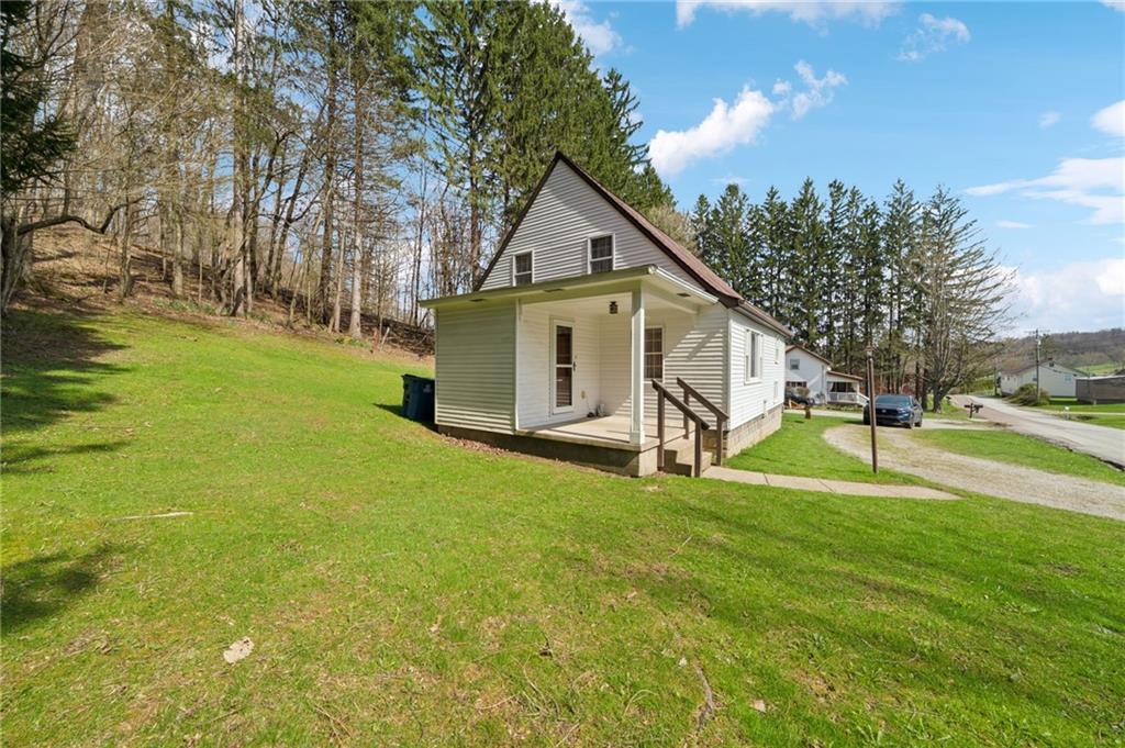 161 Millertown Road Normalville, PA 15469 - Photo 2 of 30 a view of a house with backyard and trees