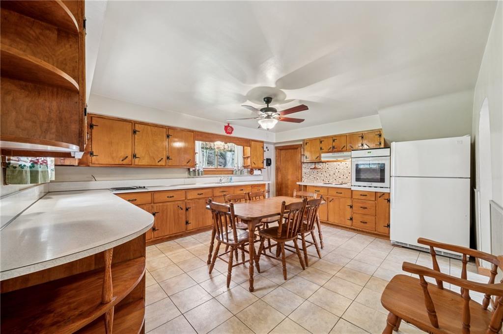 161 Millertown Road Normalville, PA 15469 - Photo 5 of 30 a view of a dining room with furniture and a chandelier