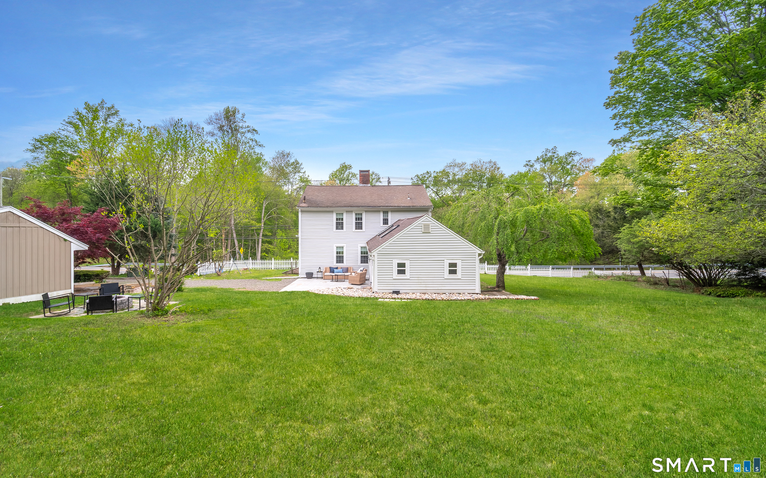 230 Killingworth Road Haddam, CT 06441 - Photo 30 of 36 a view of a house with a big yard and palm trees