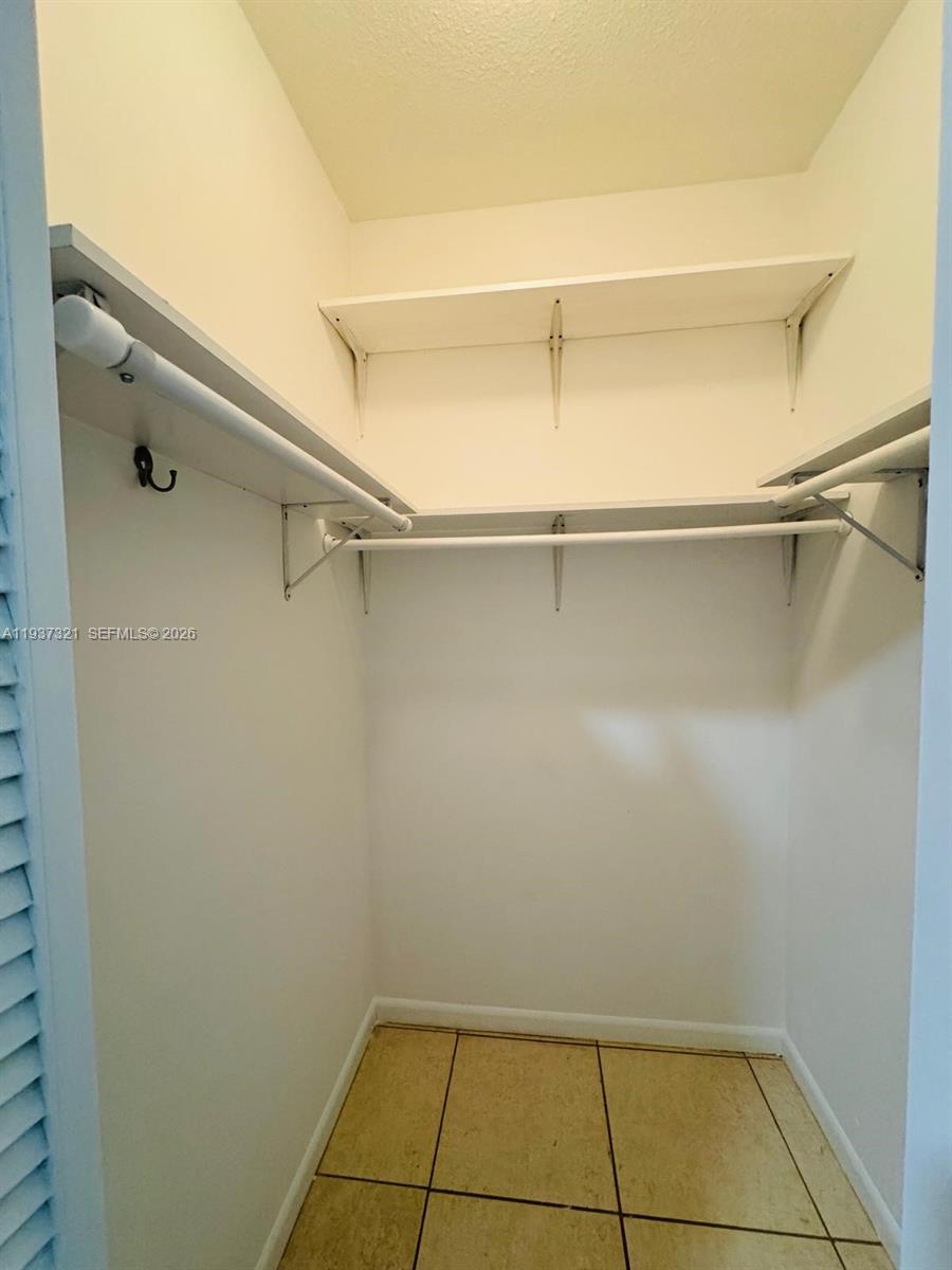 1330 Northwest 5th Street, Unit 1 Miami, FL 33125 - Photo 12 of 15 a view of a room with racks on the wall