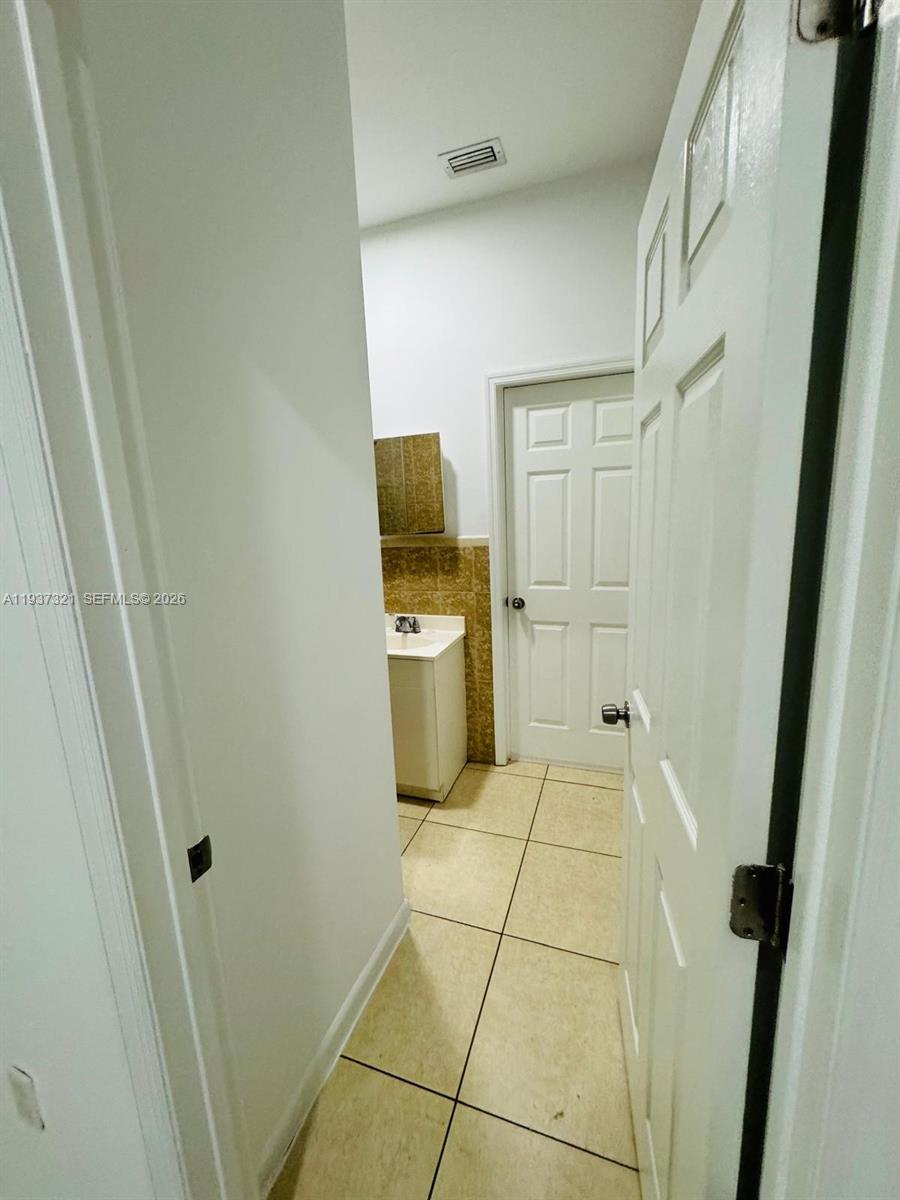 1330 Northwest 5th Street, Unit 1 Miami, FL 33125 - Photo 14 of 15 a bathroom with a sink a toilet and a shower