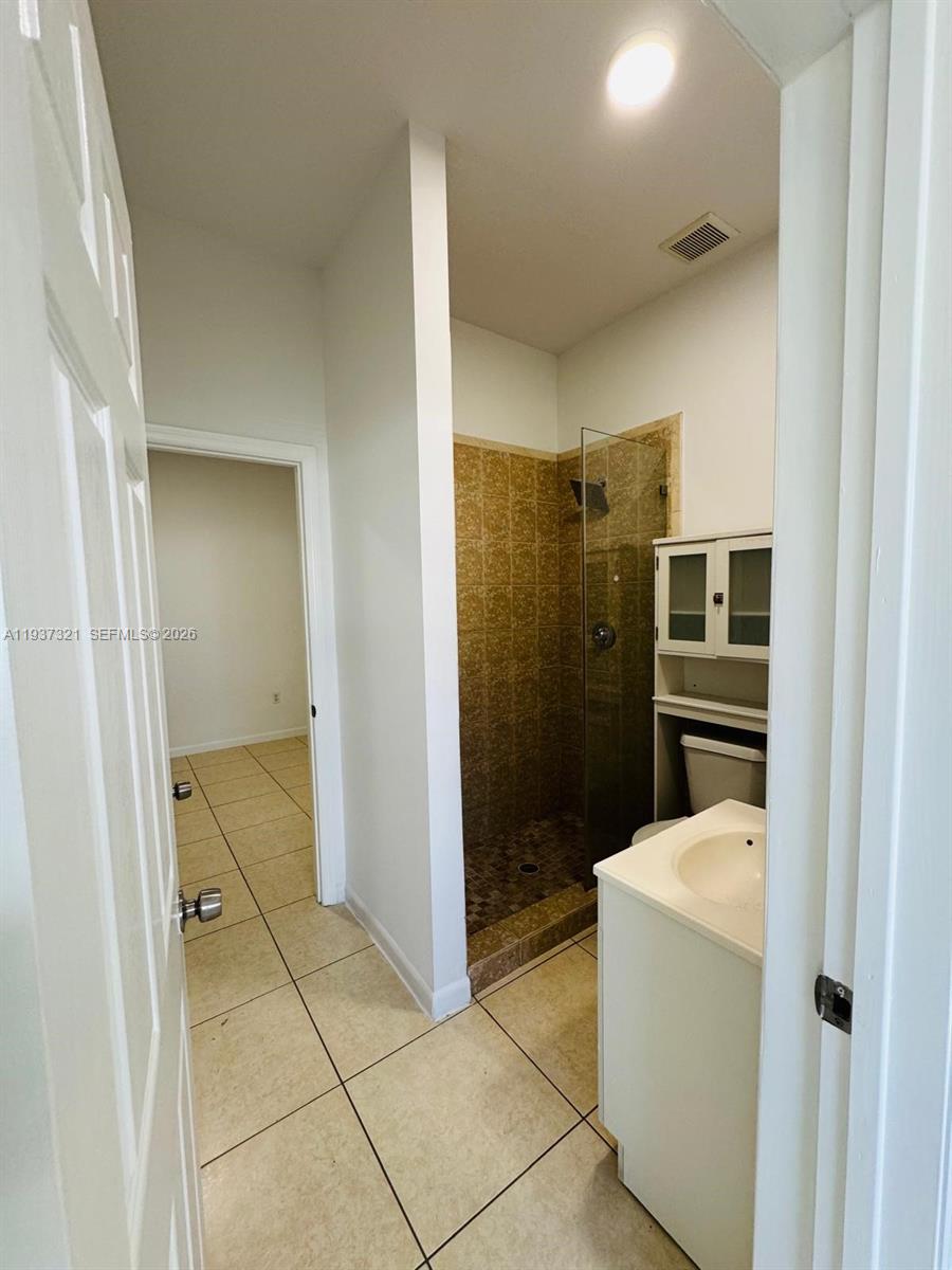 1330 Northwest 5th Street, Unit 1 Miami, FL 33125 - Photo 8 of 15 a bathroom with a shower and toilet