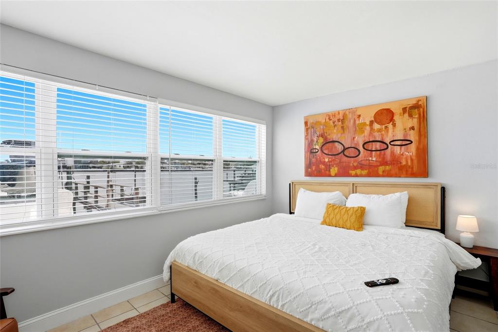 2311 Bay Boulevard Indian Rocks Beach, FL 33785 - Photo 32 of 80 a bedroom with a bed and window