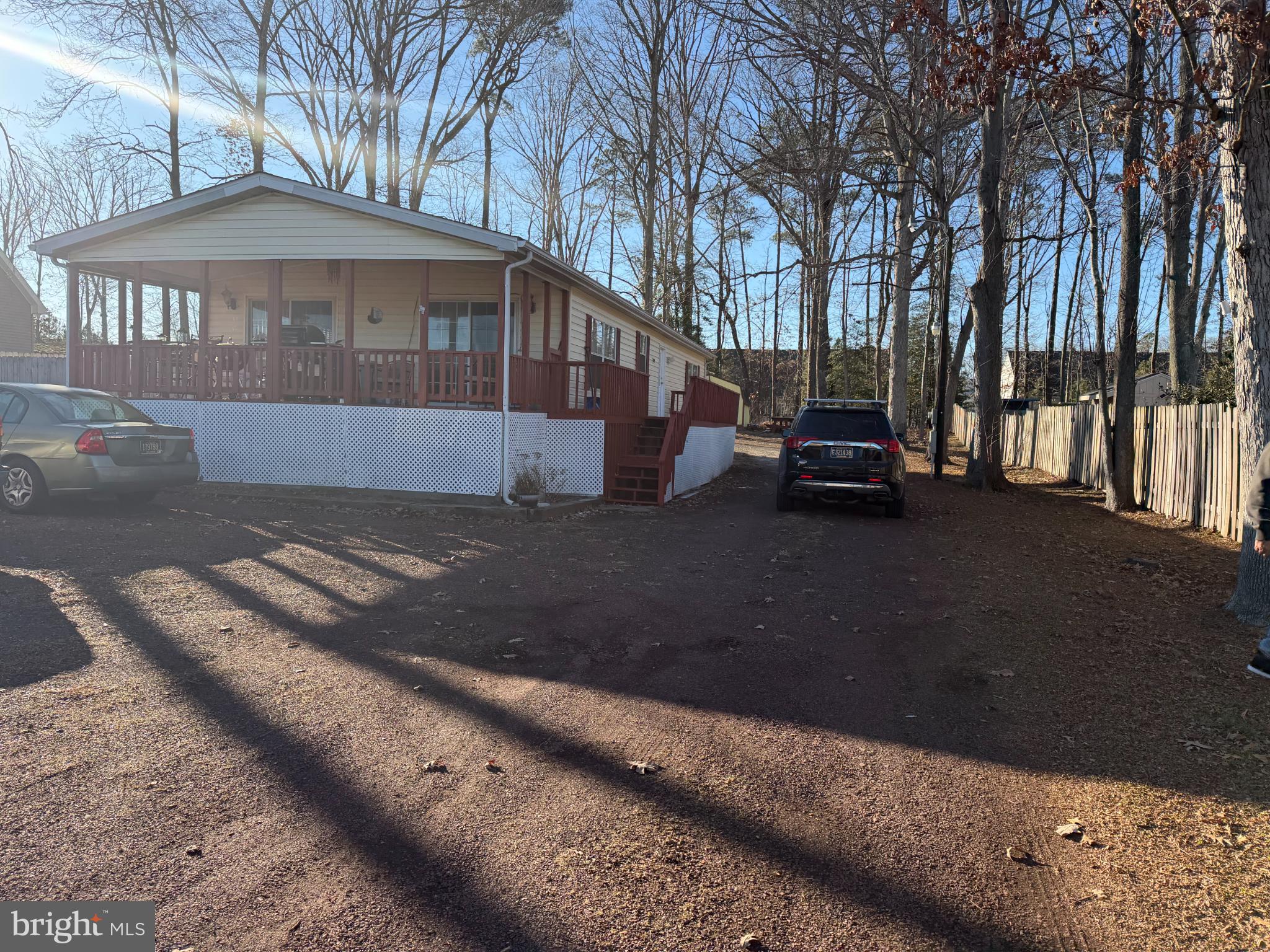 18372 Hudson Road Milton, DE 19968 - Photo 2 of 4 Charming home nestled among tall trees.