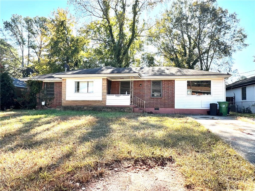 2885 Laguna Drive Decatur, GA 30032 - Photo 1 of 1 a view of a house with a yard covered with snow in the background