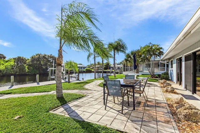 a view of a backyard with sitting area