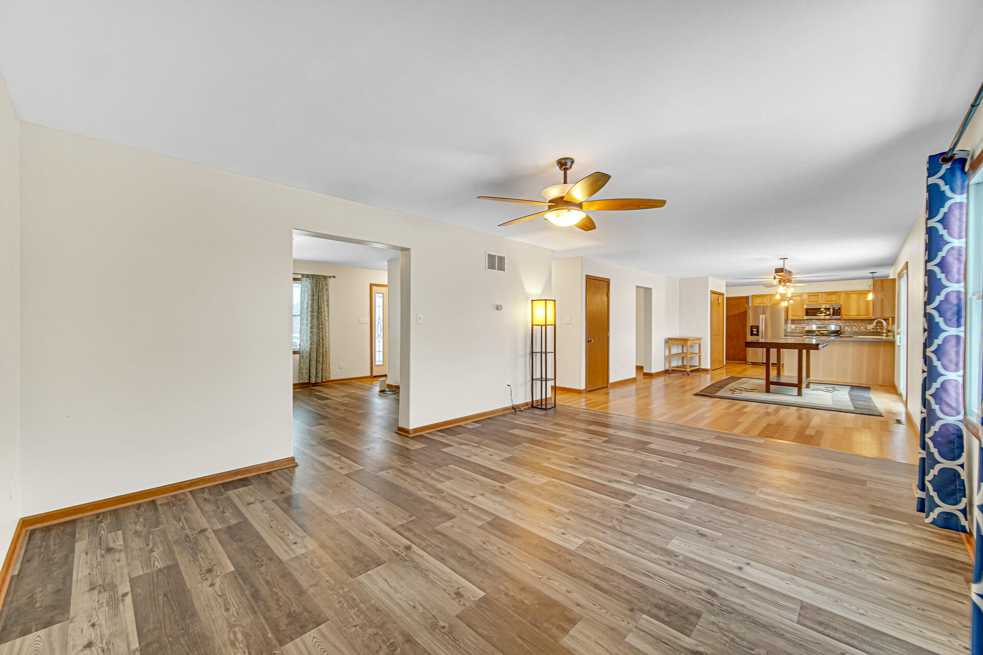 515 Tamarack Trail Hebron, IN 46341 - Photo 11 of 38 a view of empty room with wooden floor and fan