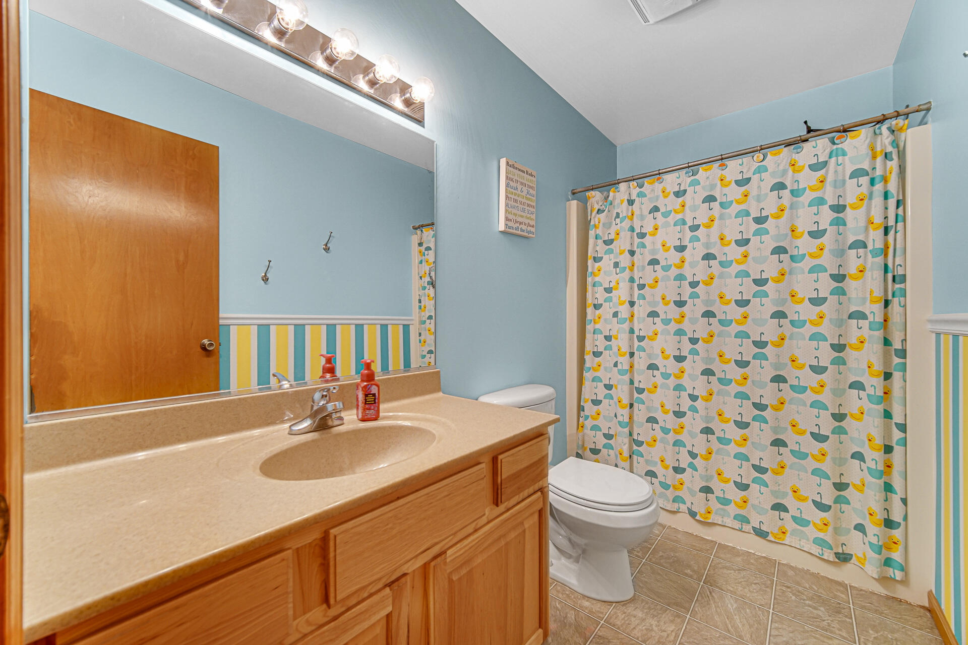 515 Tamarack Trail Hebron, IN 46341 - Photo 15 of 38 a bathroom with a sink toilet a shower and a mirror