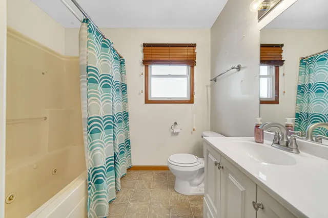 a bathroom with a sink a toilet and a bathtub
