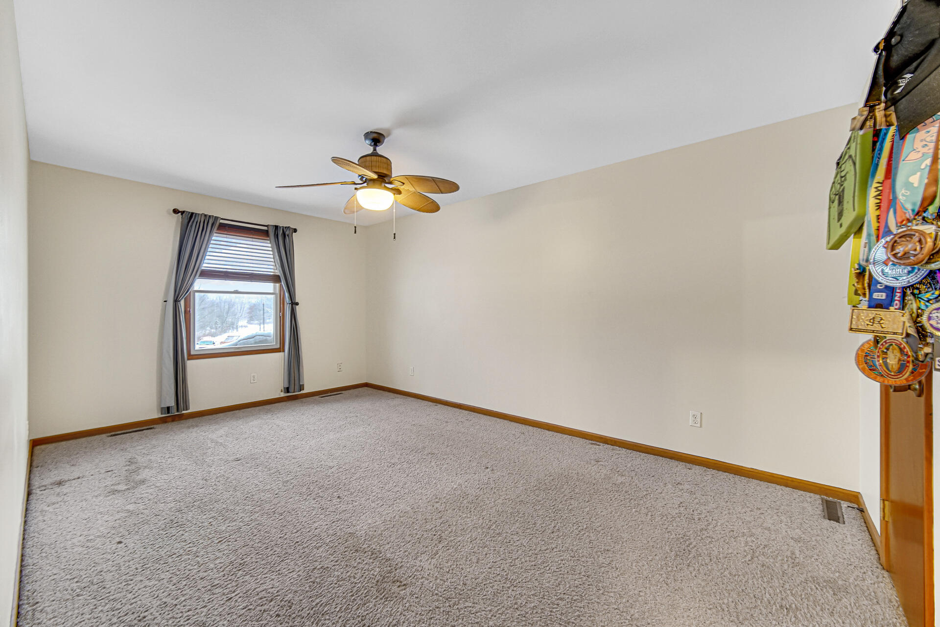 515 Tamarack Trail Hebron, IN 46341 - Photo 18 of 38 an empty room with windows and ceiling fan