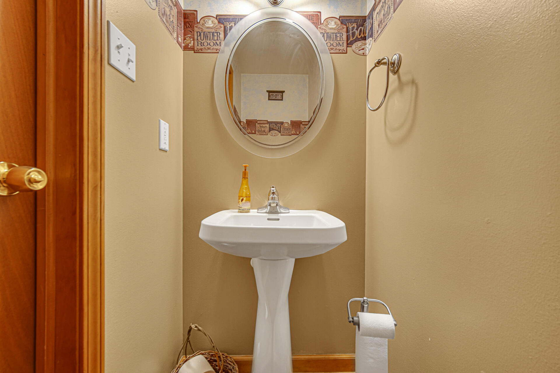 515 Tamarack Trail Hebron, IN 46341 - Photo 5 of 38 a bathroom with a sink and a mirror