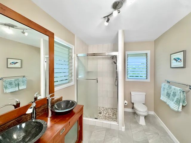 a bathroom with a toilet sink and shower