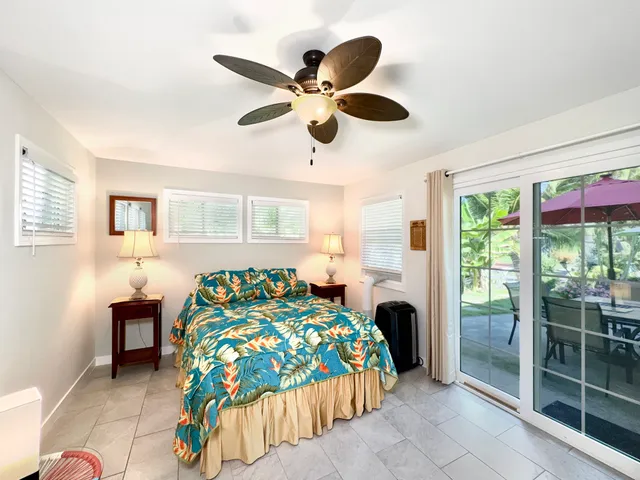 a bedroom with a bed and a table