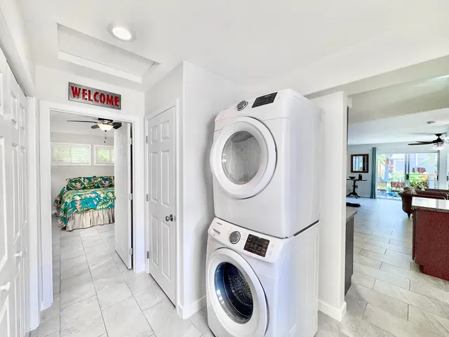 a view of a hallway with washer and dryer