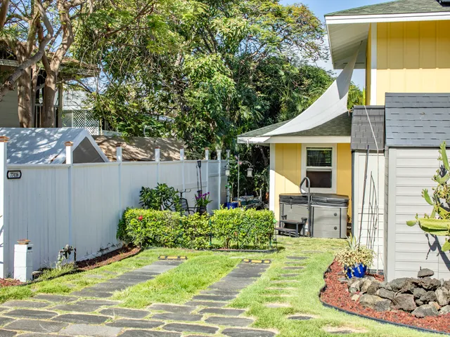 a front view of a house with garden