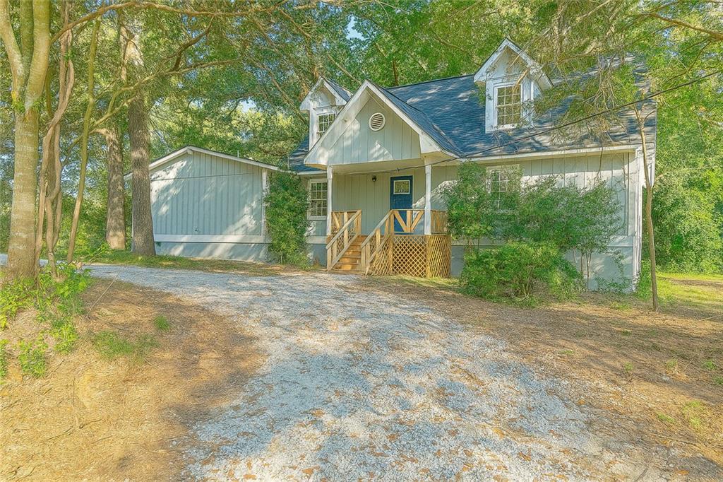 a view of a house with yard and trampoline