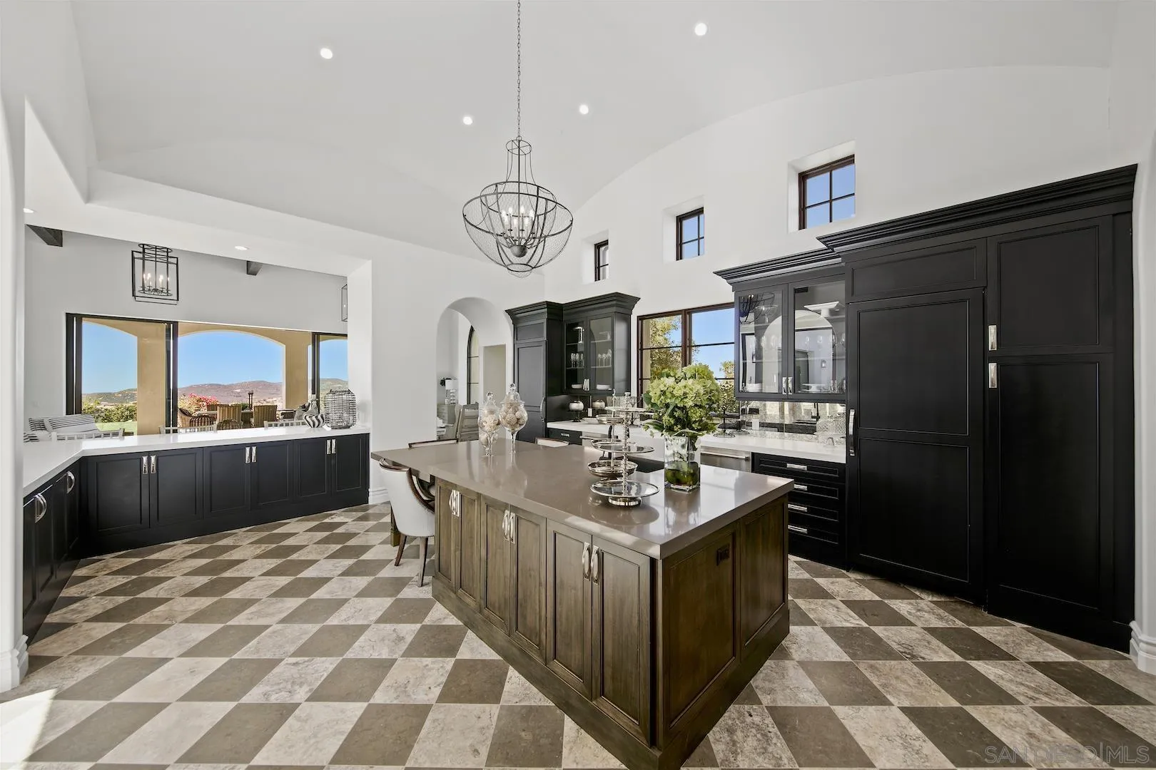 14304 Ridge Ranch Road Valley Center, CA 92082 - Photo 12 of 30 a kitchen with a sink stove and cabinets