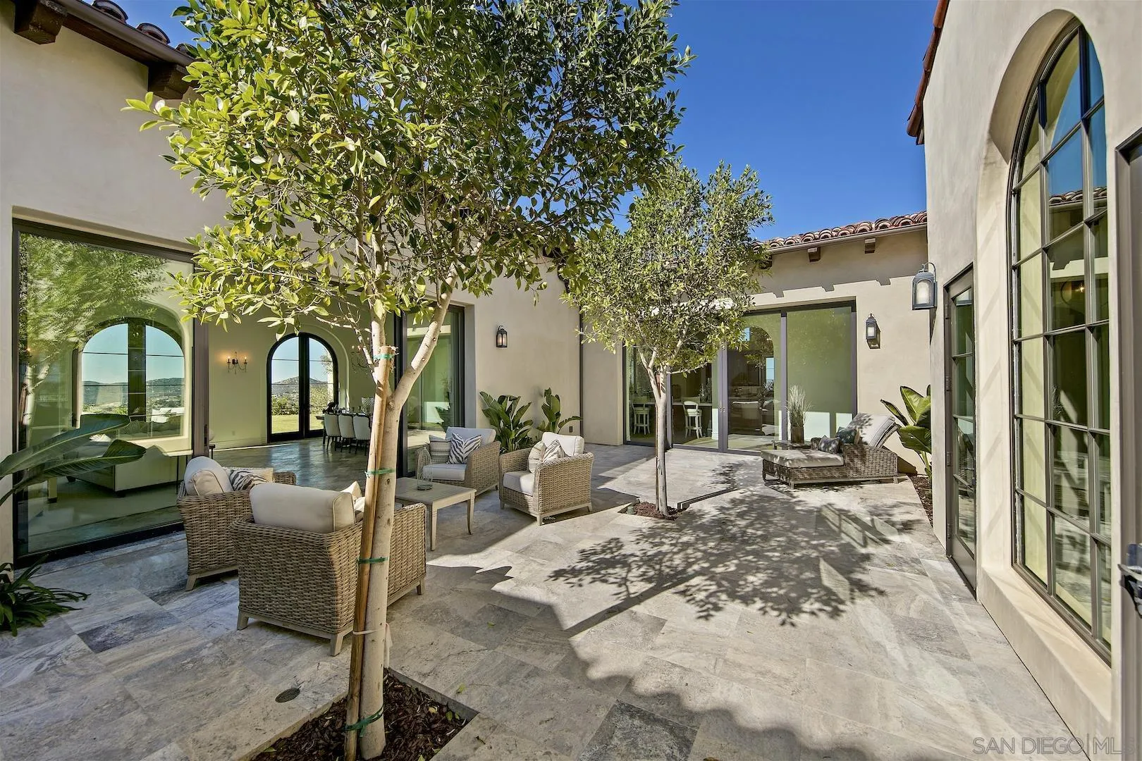 14304 Ridge Ranch Road Valley Center, CA 92082 - Photo 17 of 30 a view of a patio with couches table and chairs and potted plants