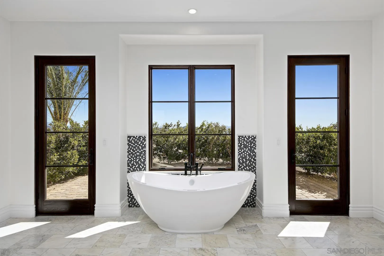 14304 Ridge Ranch Road Valley Center, CA 92082 - Photo 19 of 30 a bathroom with a bathtub and window
