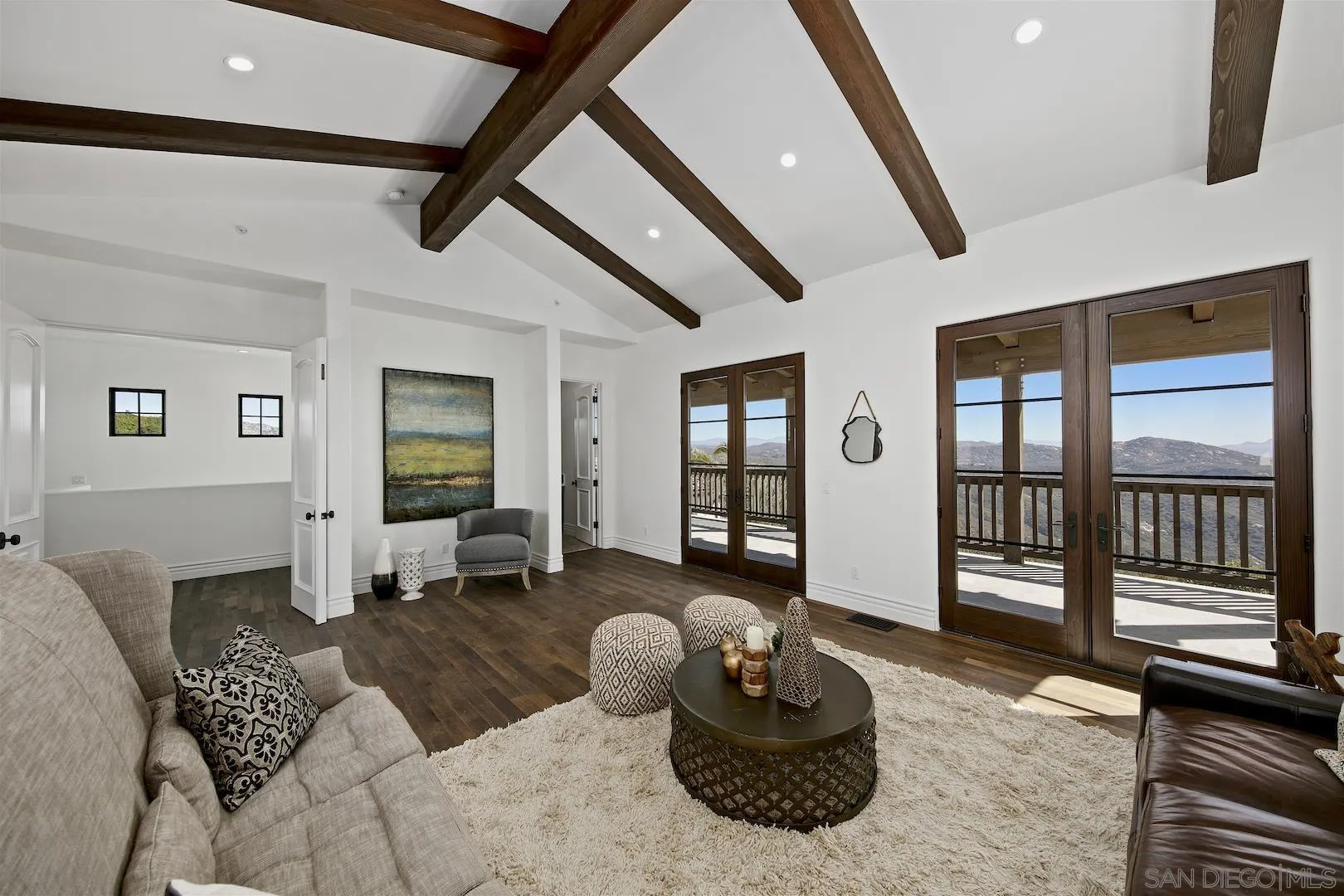 14304 Ridge Ranch Road Valley Center, CA 92082 - Photo 24 of 30 a living room with furniture and wooden floor