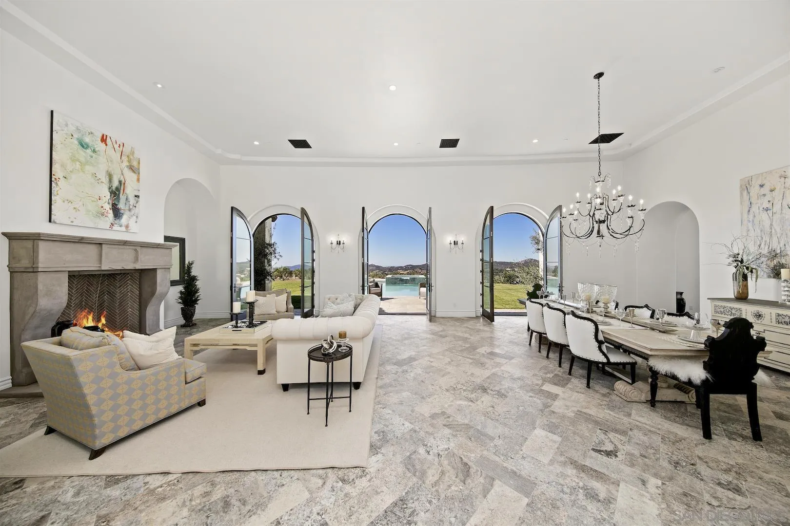 14304 Ridge Ranch Road Valley Center, CA 92082 - Photo 5 of 30 a living room with furniture chandelier and a fireplace