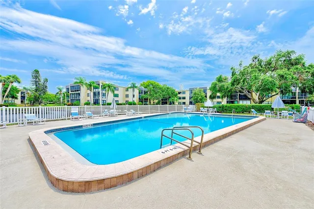 an aerial view of a house with a garden and plants