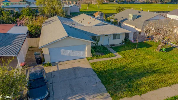 an aerial view of a house with a garden