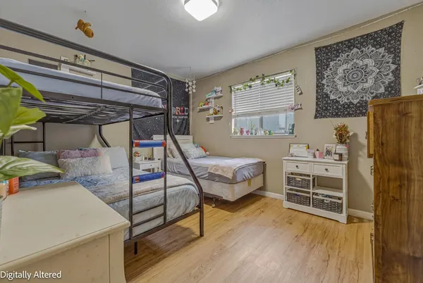 a bedroom with furniture and a fireplace